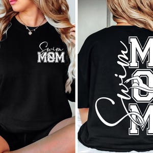 May include: Black t-shirt with the text "Swim Mom" on the front and the text "Swim Mom" with a swimmer graphic on the back.