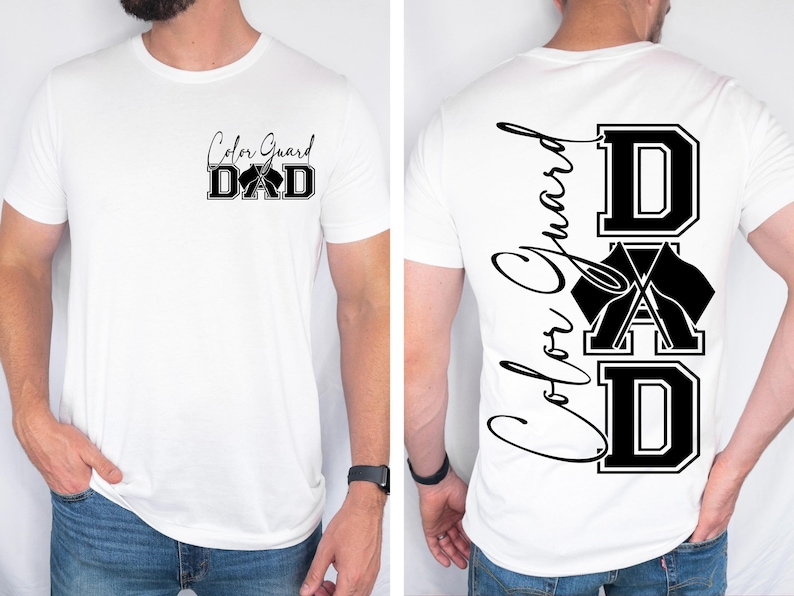 May include: White t-shirt with black text that reads "Color Guard DAD" on the front and "Color Guard DAD" vertically down the back with a graphic of crossed flags.