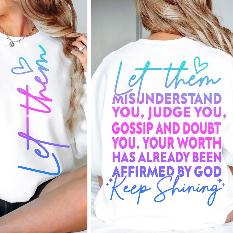 May include: White sweatshirt with the text "Let them" in a gradient blue and pink font on the front. The back of the sweatshirt has the text "Let them misunderstand you, judge you, gossip and doubt you. Your worth has already been affirmed by God. Keep Shining."