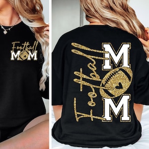 May include: Black sweatshirt with gold glitter text and a football graphic. The front of the shirt says "Football Mom" with a football graphic. The back of the shirt says "Football Mom" with a football graphic.