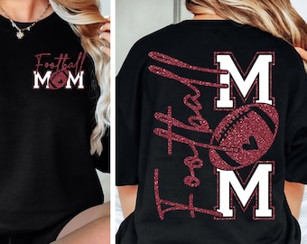 May include: Black t-shirt with the text "Football Mom" in a glittery red font, with a football graphic. The back of the shirt features a larger design with the words "Football Mom" and a football graphic.