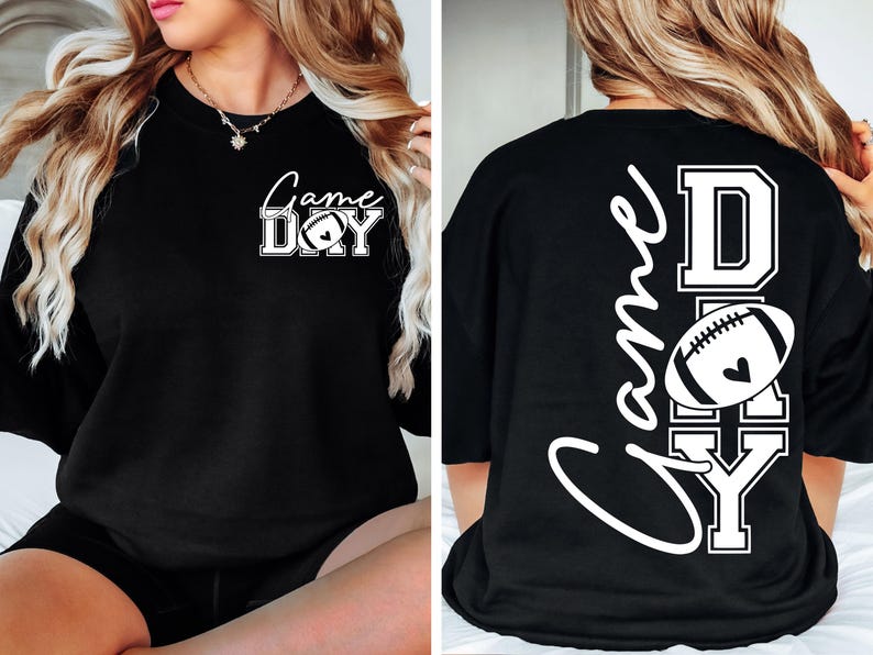 May include: Black sweatshirt with the words "Game Day" in white script and block letters, featuring a football graphic with a heart. The back of the shirt repeats the design vertically.