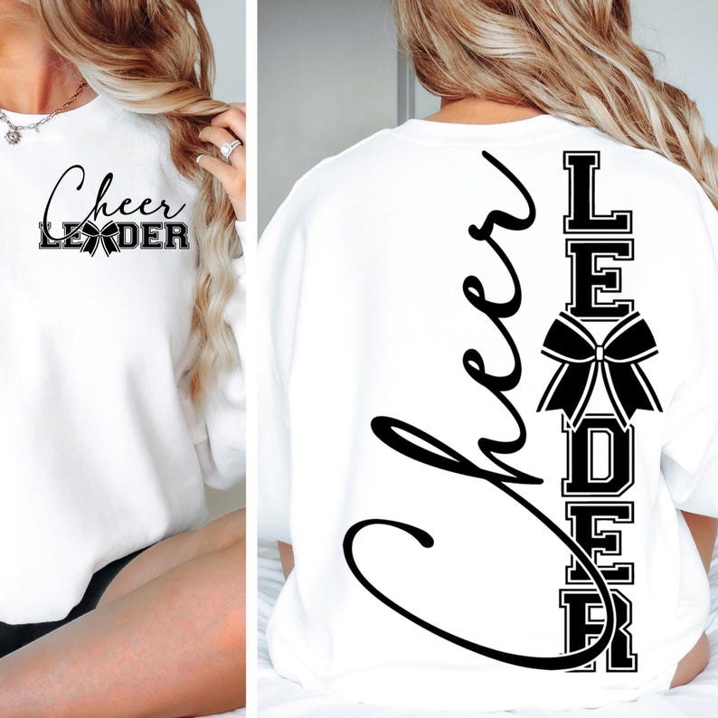 Puede incluir: Sudadera blanca con las palabras "Cheer Leader" impresas en la parte delantera y trasera. El dise&ntilde;o de la parte trasera presenta las palabras "Cheer Leader" verticalmente con un lazo negro entre las palabras.