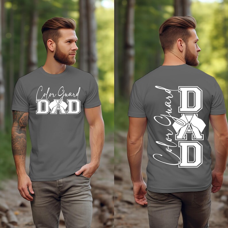 May include: A gray t-shirt with the text "Color Guard DAD" on the front and the text "Color Guard DAD" vertically on the back with a graphic of crossed flags.