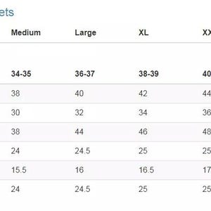 May include: A white size chart for women's leather jackets, with measurements in inches. The chart includes sizes XS to TXXL, detailing chest, waist, hip, front length, shoulder, and sleeve measurements for each size.