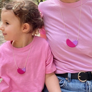 Mother and Daughter wearing Violet and Lilac Polymer Clay Necklaces