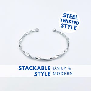May include: A silver twisted bangle bracelet. The bracelet is stackable and has a modern style. The text "STEEL TWISTED STYLE" is in a circle above the bracelet. The text "STACKABLE STYLE DAILY & MODERN" is below the bracelet.