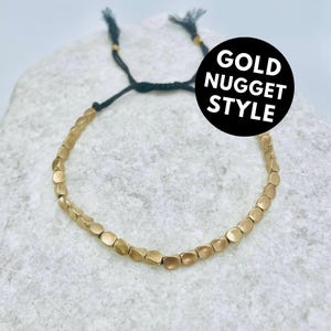 Gold Nugget Bracelet Knotted Artisan Adornment Bohemian Coastal Wanderlust Wristwear Sunlit Stacking Metallic Pebble Rustic Festive Amulet