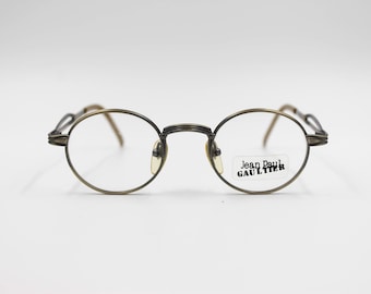 Vintage Eyeglasses Jean Paul Gaultier 55 7107 authentic and rare oval titan frame wiht demo lenses Made in Japan New Old Stock