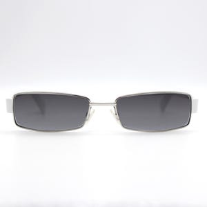 May include: Silver-framed sunglasses with rectangular, gradient gray lenses. The sunglasses have a sleek, modern design with a thin silver bridge and white accents on the temples. A stylish accessory for eye protection.