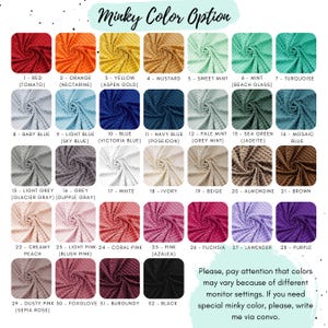 May include: A color chart displaying 32 swatches of textured minky fabric, each labeled with a number and color name. The grid includes shades of red, orange, yellow, green, blue, grey, white, beige, brown, pink, purple, and black fabric samples.