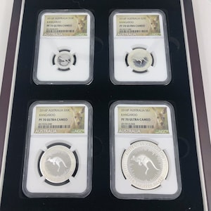 May include: Four silver Australian Kangaroo coins in protective plastic cases. Each case has a label with the year 2016P, the coin denomination, and the words "Kangaroo", "PF 70 Ultra Cameo", and "NGC".