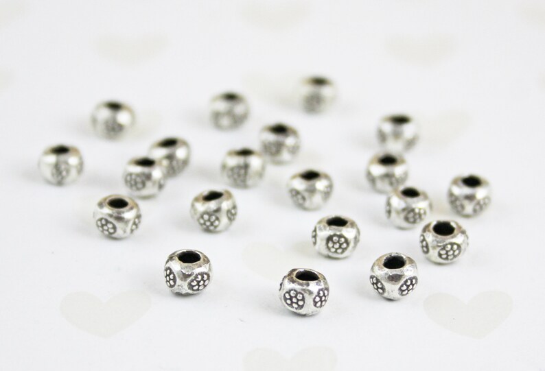 10 Per pkg 5 X 4 mm Karen Hill Tribe Silver 10 Daisy Print Rondelle Beads
