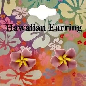 May include: A pair of pink and yellow flower-shaped earrings with the text "Hawaiian Earring" on a colorful background.