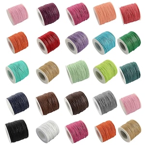 May include: Assortment of 20 spools of waxed cotton cord in various colors, including red, blue, green, brown, black, white, and pink. Each spool is wound with a different color cord.