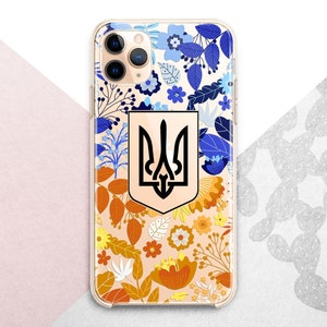 May include: A clear phone case with a floral design featuring blue, yellow, and orange flowers. The case has a black and gold Ukrainian trident emblem in the center.