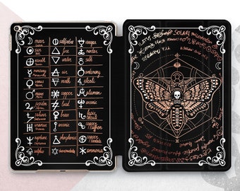 May include: A black and white iPad case with a rose gold design. The front of the case features a geometric design with a moth and skull. The back of the case features a chart with symbols and text.