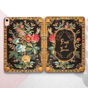 May include: A black and gold iPad case with a floral design and the text "Book of Flowers".