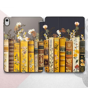 May include: A navy blue iPad case with a floral design and a row of vintage books with yellow spines. The books have gold lettering and illustrations.