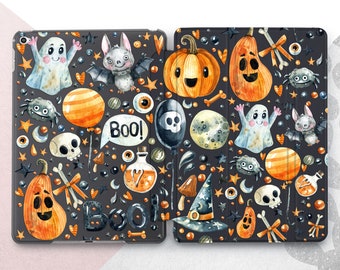 May include: A black and white Halloween-themed iPad case with a variety of spooky and cute illustrations, including ghosts, bats, pumpkins, skulls, and stars. The case has a repeating pattern and the words "Boo!" and "Boo" are visible.