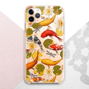 May include: A clear phone case with a colorful design featuring koi fish, water lilies, and dragonflies. The case is compatible with iPhone models.
