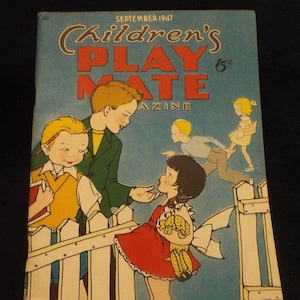 May include: A vintage Children's Playmate magazine cover from September 1947 featuring an illustration of four children. The cover features a boy in a green jacket talking to a girl in a red dress. The girl is holding a basket of corn. The magazine cover is blue with a white picket fence in the background.
