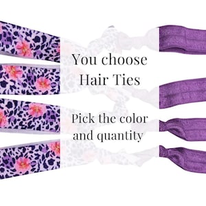 May include: Elastic hair ties featuring a purple leopard print with pink floral accents on one side and solid purple on the other. The text "You choose Hair Ties" and "Pick the color and quantity" is centered between the four hair ties.