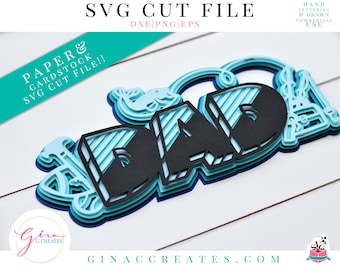 May include: Layered paper cut file design of the word "DAD" in blue and black with a striped pattern. The design includes a small anchor and a fish.