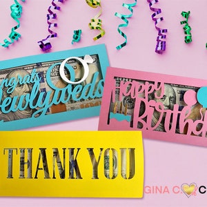 May include: Three colorful card holders with cut-out designs for cash gifts. The designs include "Congrats Newlyweds" with wedding rings, "Happy Birthday" with balloons, and "Thank You".