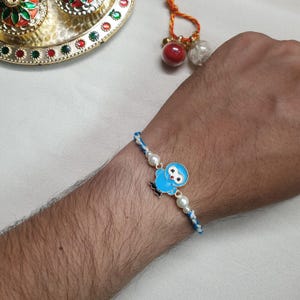 Rakhi à breloque oiseau bleu, fil de coton Rakhi pour enfants