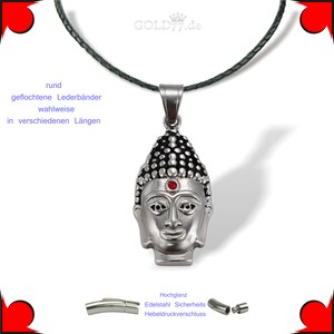 Puede incluir: Collar con colgante de cabeza de Buda de plata con una piedra roja en la frente. El collar tiene un cord&oacute;n de cuero negro y un cierre de palanca.
