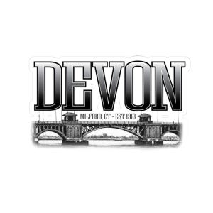 May include: A black and white sticker featuring the word "DEVON" in a bold, stylized font. Below the word is "MILFORD, CT - EST 1913" and an illustration of a bridge.