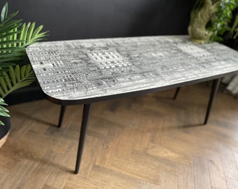 Vintage mid-century coffee table refinished with Fornasetti 'Riflesso' art print
