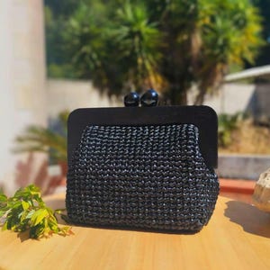 Click clack bag in shiny raffia, completely handmade. Elegant and chic bag