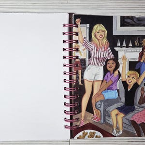 May include: An illustration in a spiral-bound notebook depicts a group of people celebrating. A woman in a pink striped shirt and white shorts stands with her arm raised. Other figures are seated and standing, with arms raised in celebration. A plate of cookies is in the foreground.