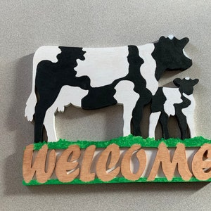 Cow and calf Welcome sign