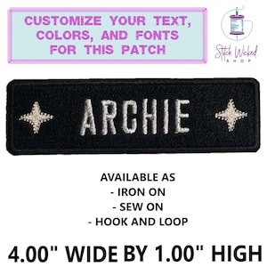 May include: Black iron-on or sew-on patch with white text that reads "ARCHIE" and two white stars. The patch is 10.16 cm wide and 2.54 cm high. Customize your text, colours, and fonts for this patch.