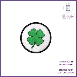May include: Green four-leaf clover embroidered patch in a white circle with a black outline.  Available in various sizes. Choose your custom colours. Stitch Wicked Shop.