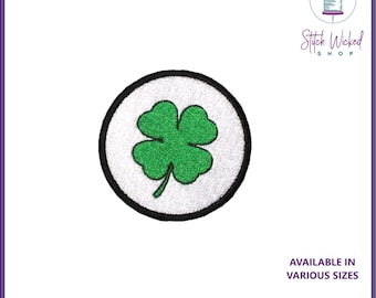 May include: Green four-leaf clover embroidered patch in a white circle with a black outline.  Available in various sizes. Choose your custom colors. Stitch Wicked Shop.