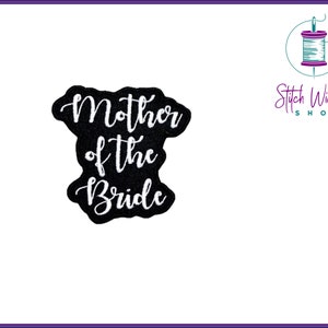 May include: Black felt patch with white embroidery that reads "Mother of the Bride".