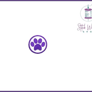 May include: Purple paw print embroidered iron-on patch on a white background.
