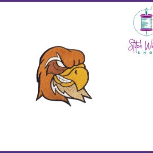 May include: Embroidered patch of a cartoon eagle head with a fierce expression. The eagle has brown and yellow feathers and a sharp beak.