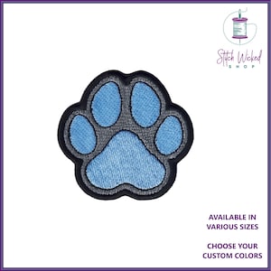 May include: Blue paw print embroidered patch with a grey outline. Available in various sizes and custom colours. Stitch Wicked Shop.
