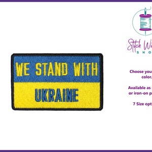 May include: Embroidered patch with the text "We Stand With Ukraine" in blue and yellow, the colors of the Ukrainian flag. The patch is available in 7 sizes and can be sewn or ironed on.