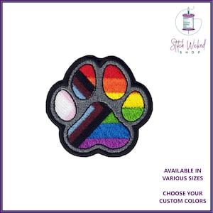 May include: A gray paw print embroidered patch with a rainbow, transgender, and bisexual pride flag design. The patch is available in various sizes and custom colors.