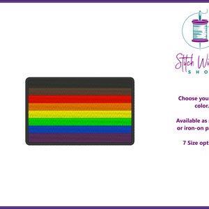 May include: A rainbow pride flag with black, red, orange, yellow, green, blue, and purple stripes. The flag is available as a sew-on or iron-on patch in 7 sizes. Choose your edge colour.