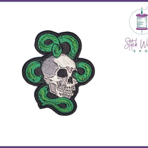May include: Embroidered iron-on patch featuring a white skull with a green snake wrapped around it.