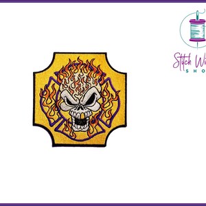 May include: An embroidered patch featuring a white skull with flames in orange and yellow, set against a yellow background with a purple border. The skull is surrounded by a stylized fire hydrant design.