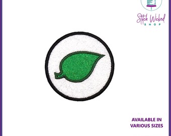 May include: Green leaf embroidered patch in a white circle with a black outline. The patch is available in various sizes and custom colors. Stitch Wicked Shop.