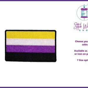 May include: An embroidered patch featuring the non-binary pride flag. The flag has five horizontal stripes: yellow, white, purple, white, and black. The patch is available in various sizes and can be sewn or ironed onto fabric.